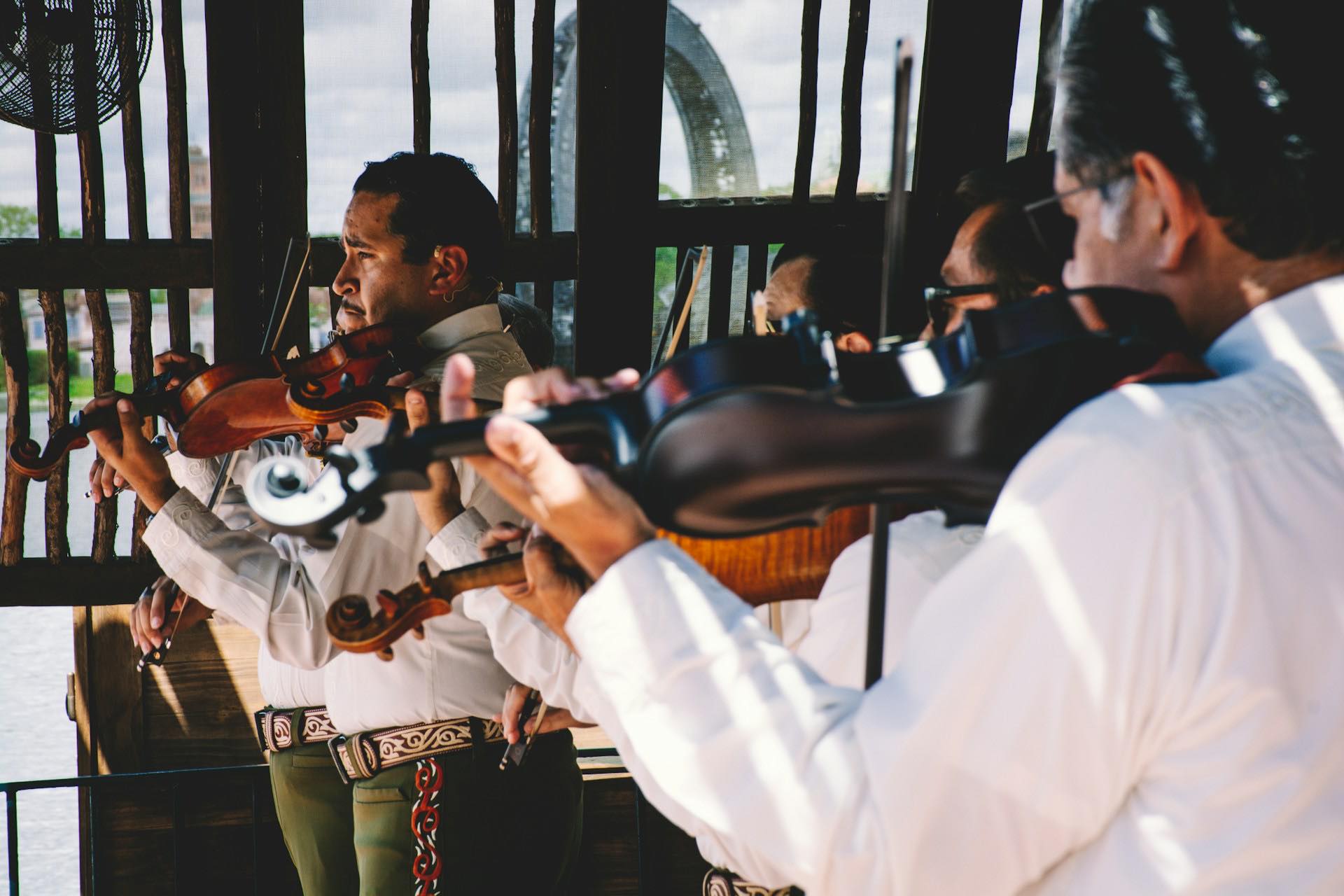 Mariachi musicians performing in traditional charro suits